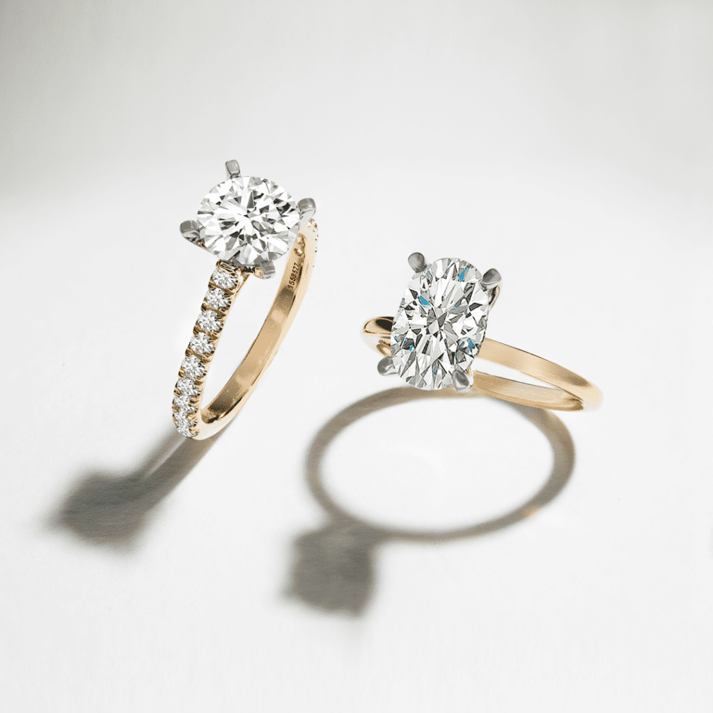 Round center stone shown and Oval center stone shown with 14k yellow gold and 14k white gold diamond engagement rings