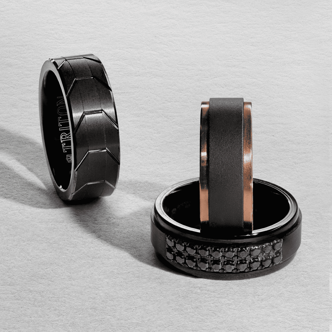 Modern mens wedding bands in black tungsten carbide and rose gold
