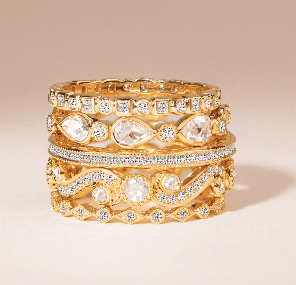 Sethi designer women's wedding bands in yellow gold with intricate diamond details