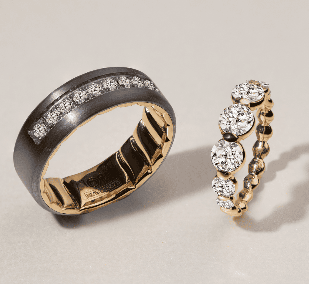 Matching yellow gold couple’s wedding bands with diamond detail